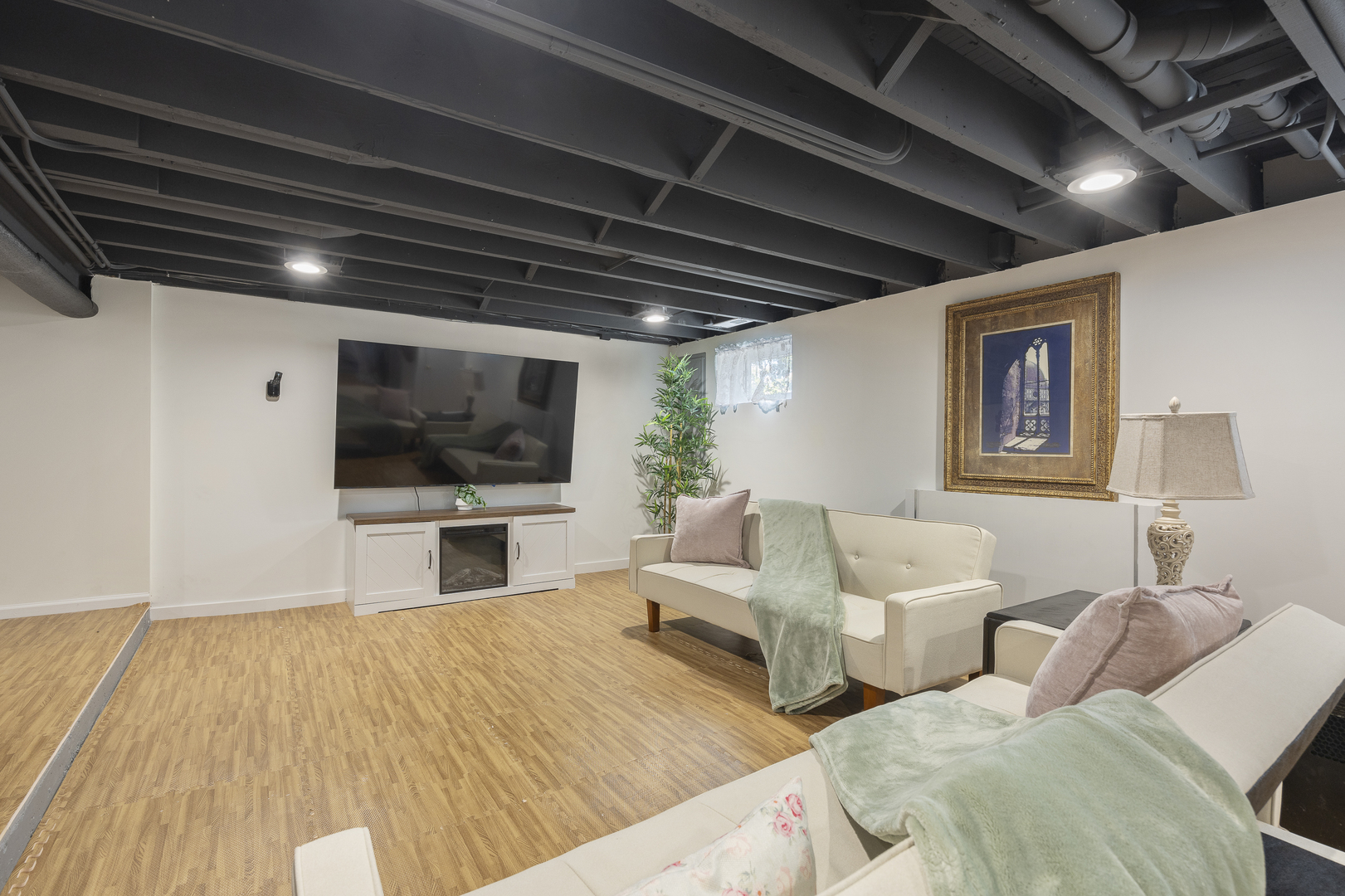 300 Geneva Road Glen Ellyn, IL 60137 - Photo 29 of 41 a living room with couches and a flat screen tv