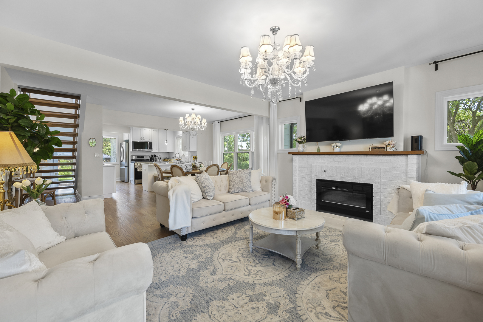 300 Geneva Road Glen Ellyn, IL 60137 - Photo 4 of 41 a living room with furniture a flat screen tv and a fireplace