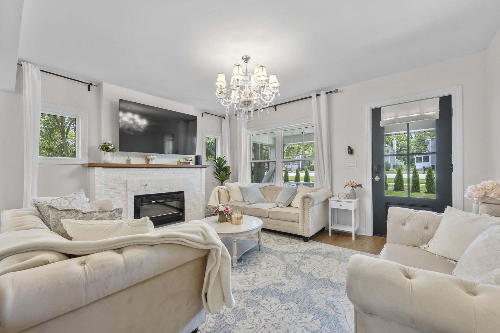 300 Geneva Road Glen Ellyn, IL 60137 - Photo 5 of 41 a living room with furniture a flat screen tv and a fireplace