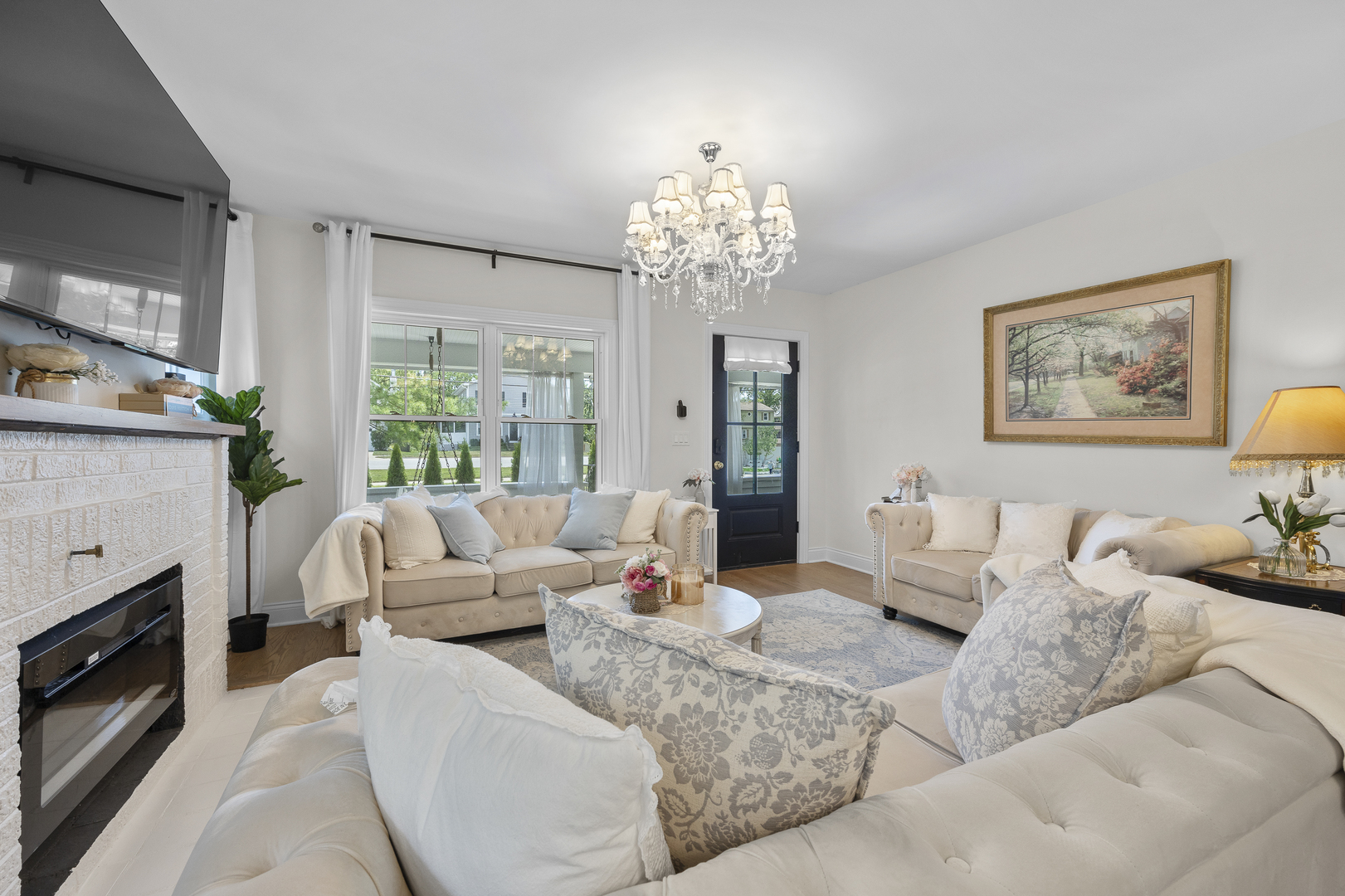 300 Geneva Road Glen Ellyn, IL 60137 - Photo 6 of 41 a living room with furniture chandelier and a fireplace