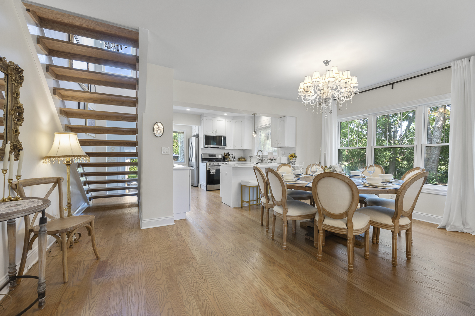 300 Geneva Road Glen Ellyn, IL 60137 - Photo 8 of 41 a view of a dining room with furniture wooden floor and chandelier