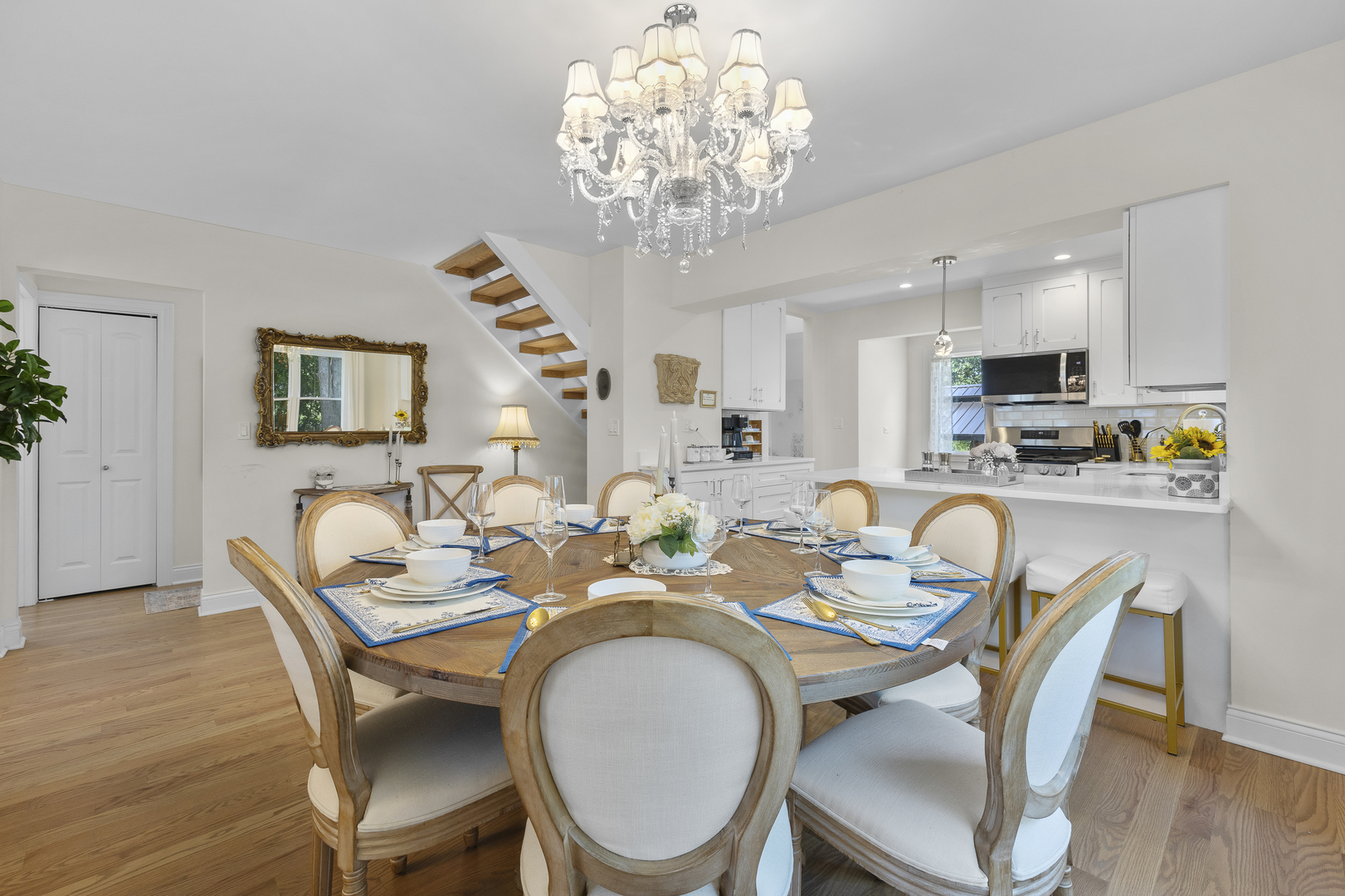 300 Geneva Road Glen Ellyn, IL 60137 - Photo 10 of 41 a dining room with furniture a chandelier and wooden floor