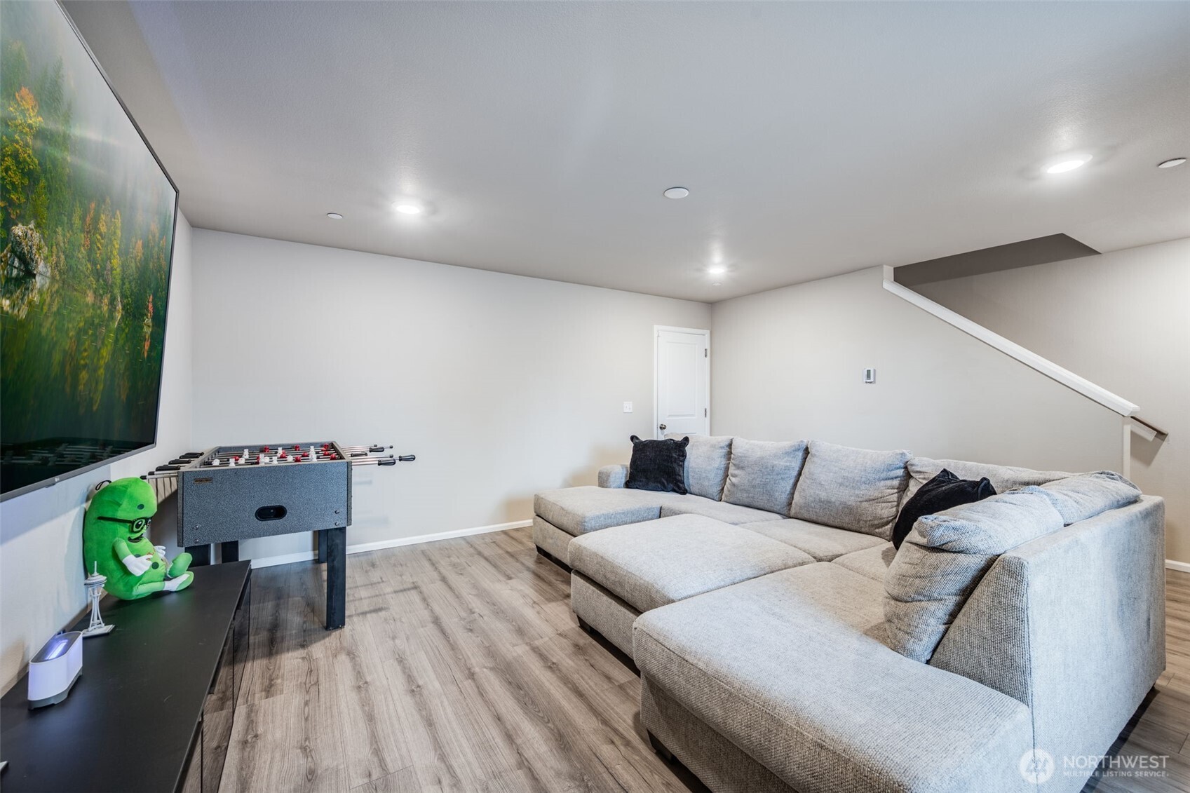 17539 110th Avenue East, Unit H Puyallup, WA 98374 - Photo 20 of 40 a living room with furniture and a wooden floor