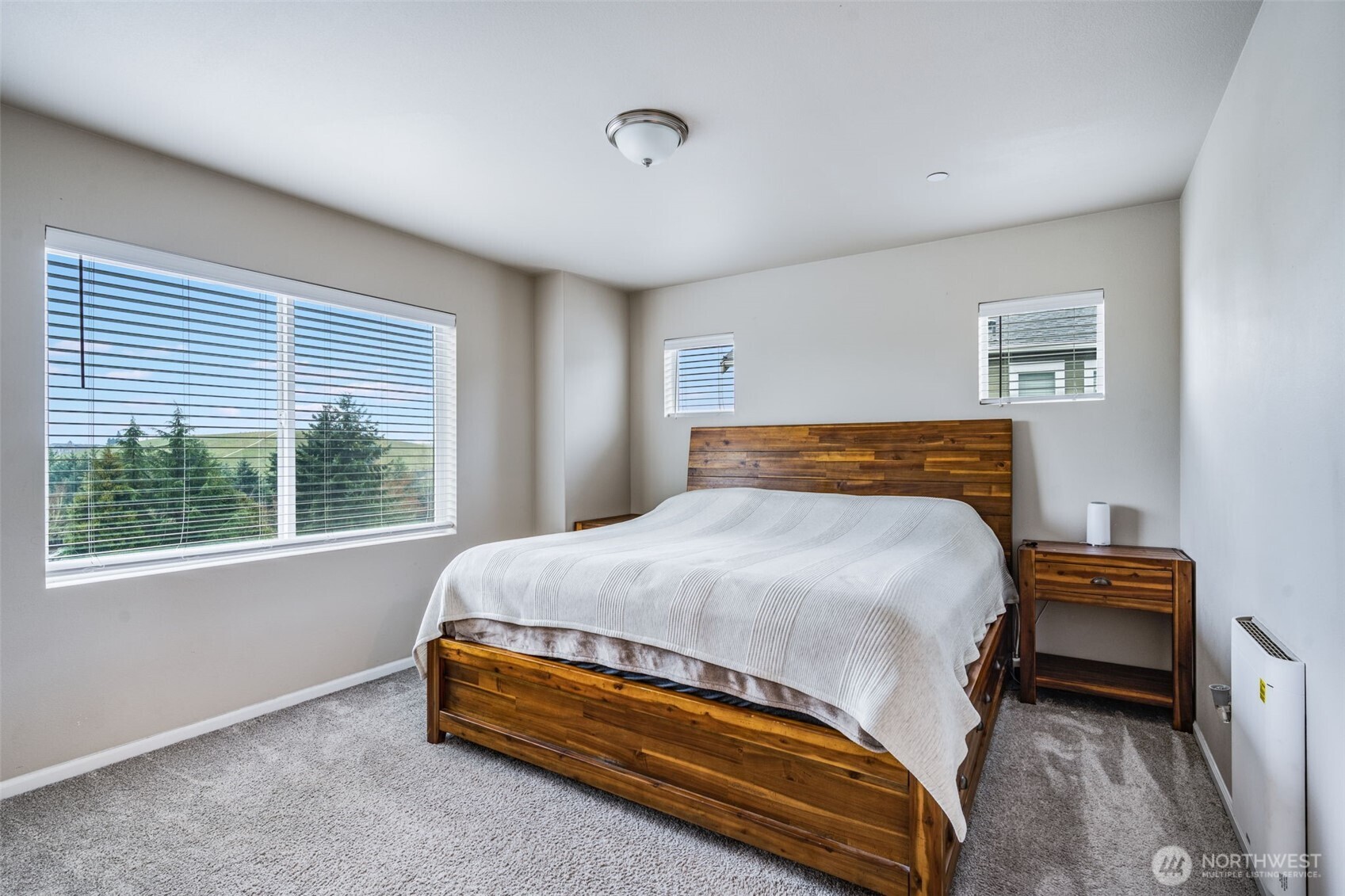 17539 110th Avenue East, Unit H Puyallup, WA 98374 - Photo 24 of 40 a bedroom with a bed and window