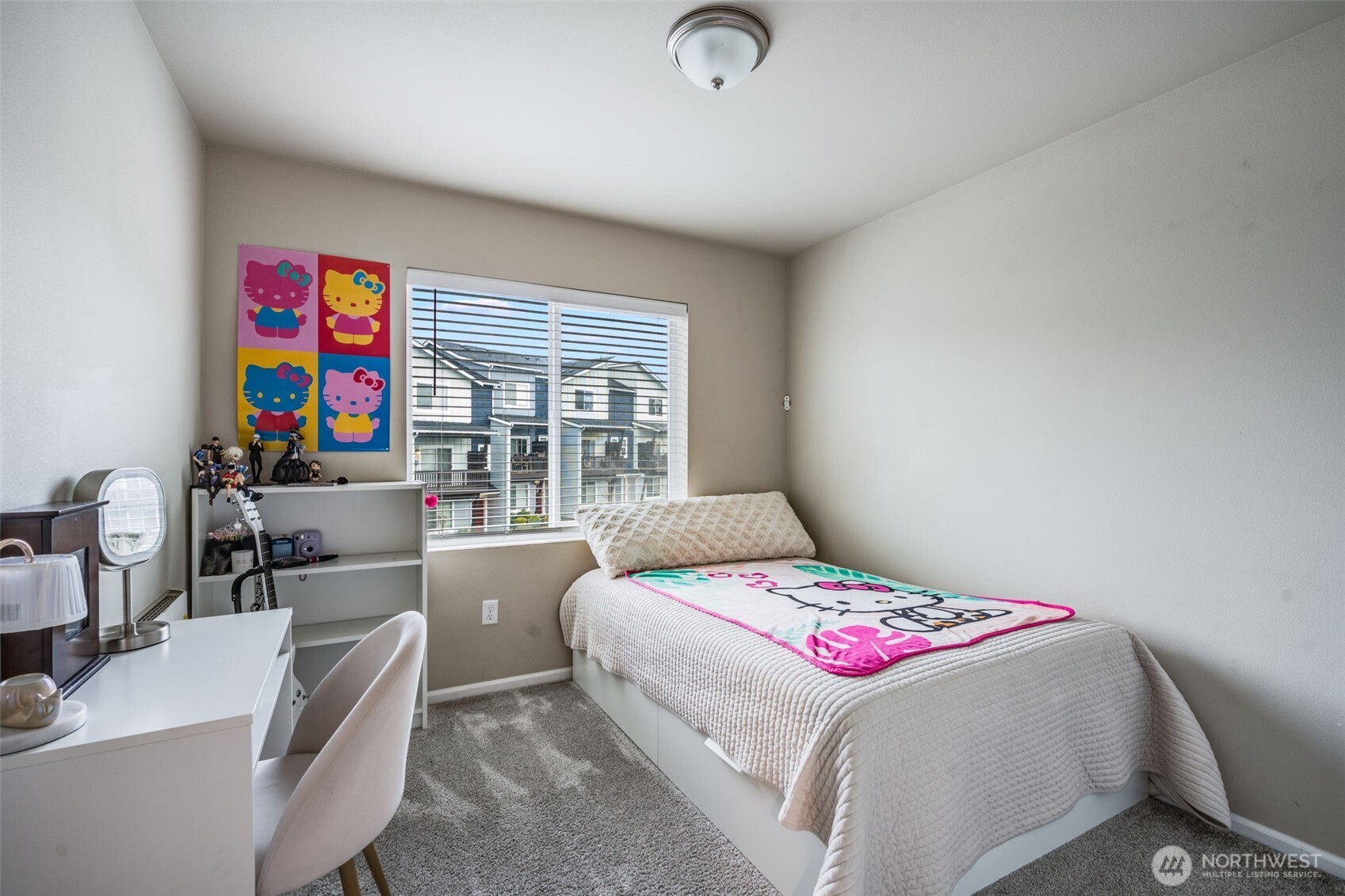 17539 110th Avenue East, Unit H Puyallup, WA 98374 - Photo 29 of 40 a bedroom with a bed and a desk