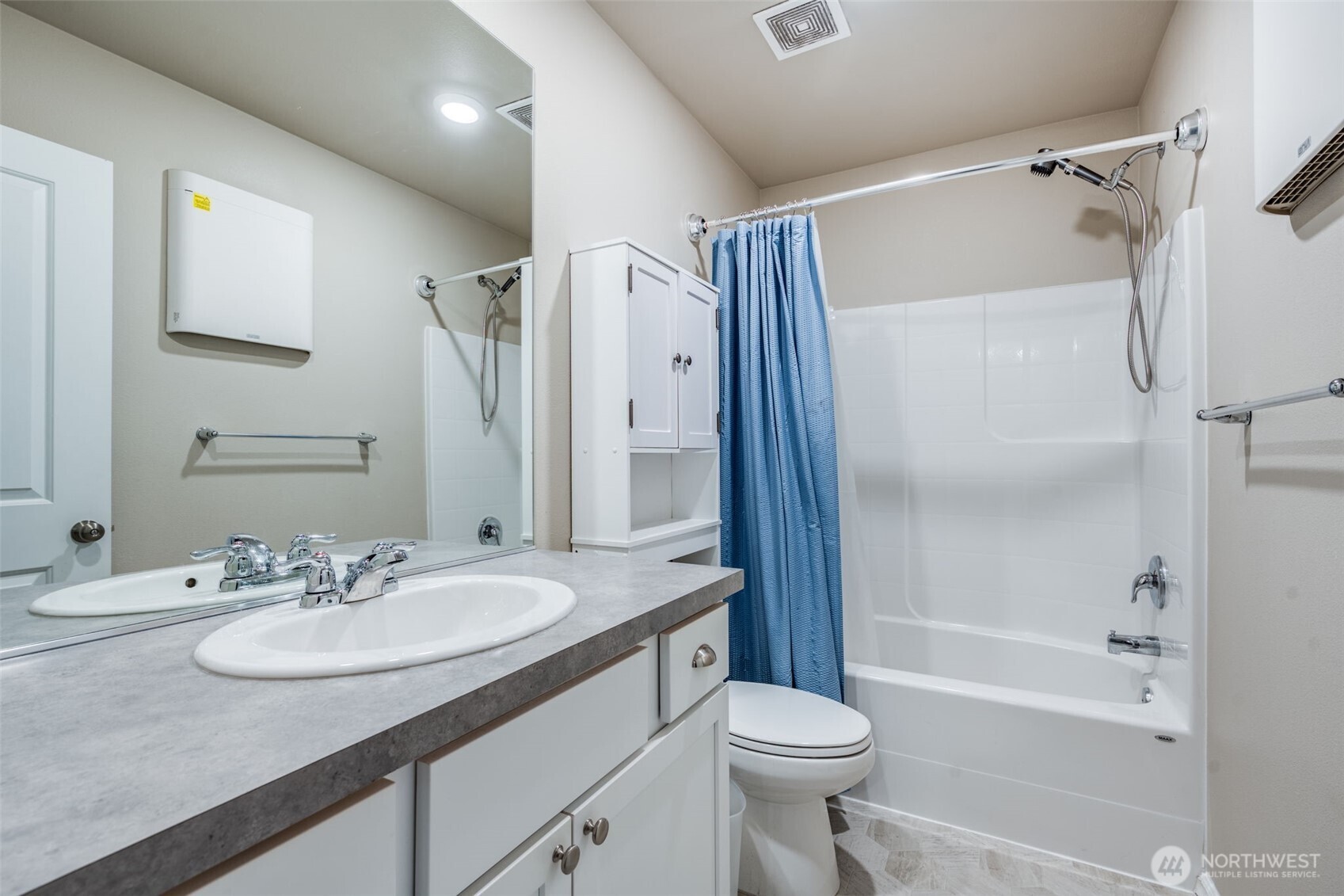 17539 110th Avenue East, Unit H Puyallup, WA 98374 - Photo 31 of 40 a bathroom with a sink toilet vanity and shower