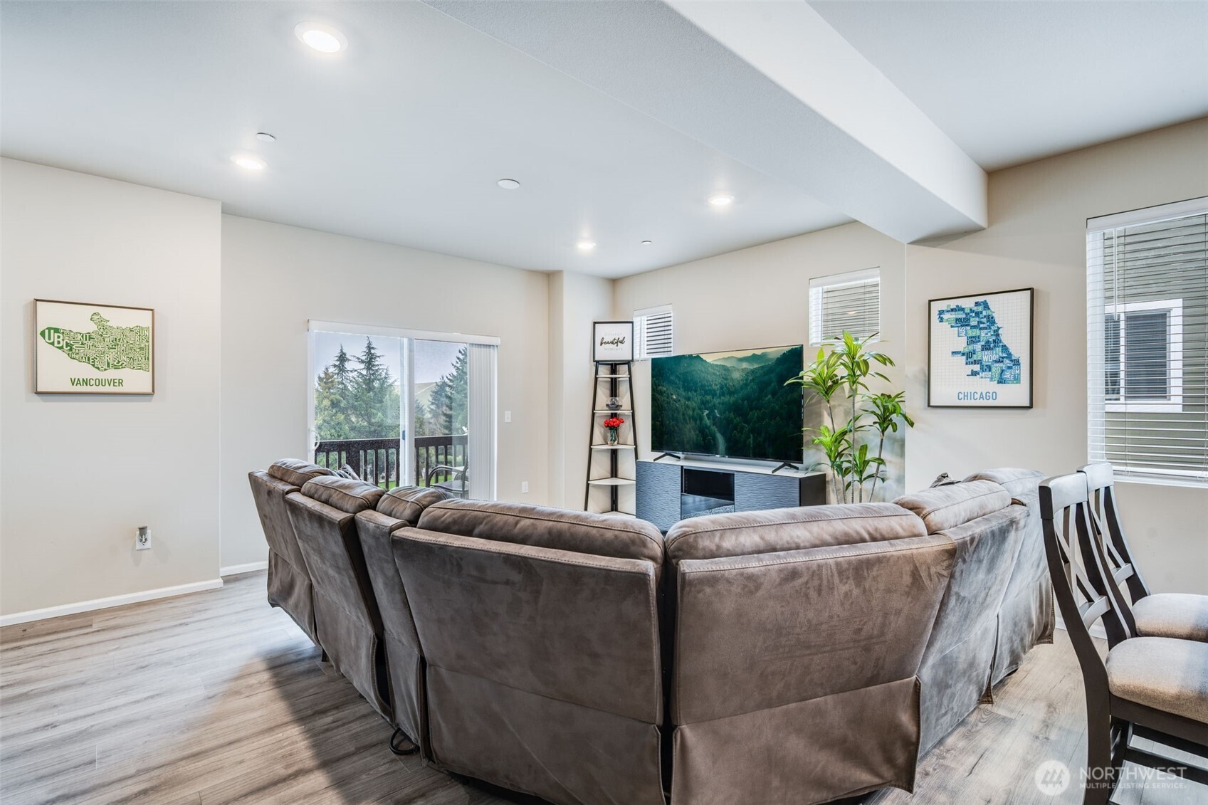 17539 110th Avenue East, Unit H Puyallup, WA 98374 - Photo 6 of 40 a living room with furniture a flat screen tv and a large window
