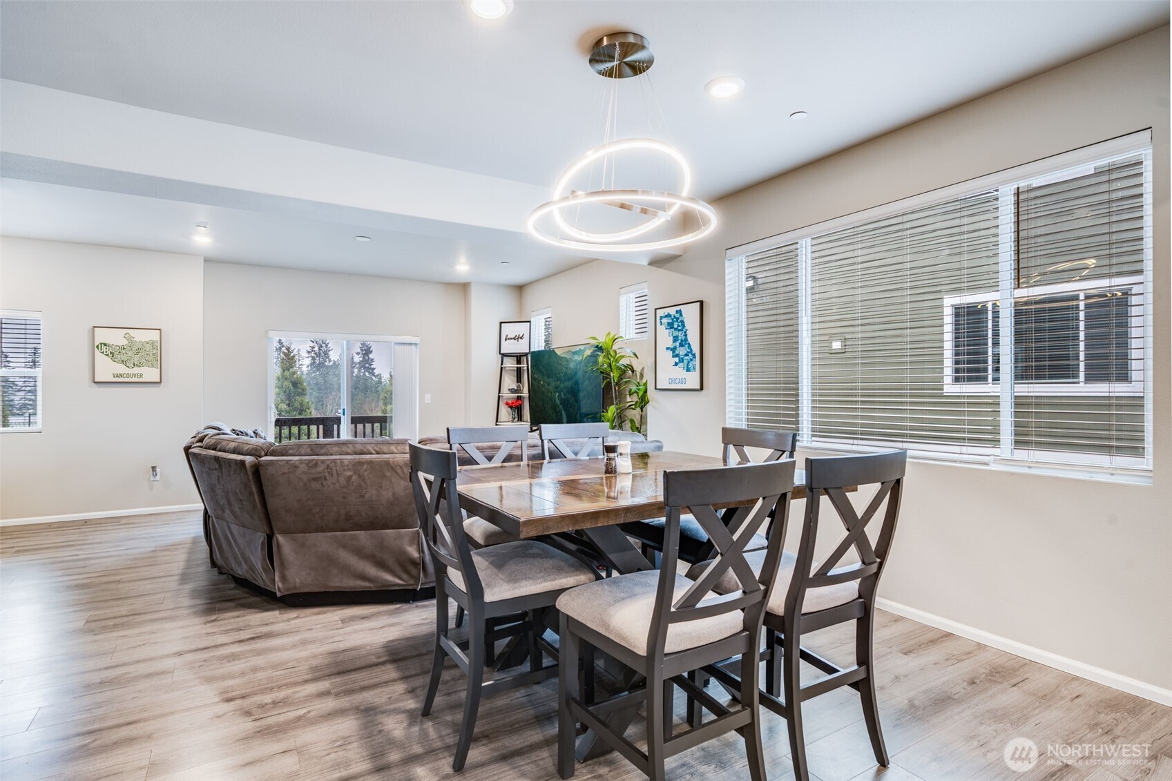 17539 110th Avenue East, Unit H Puyallup, WA 98374 - Photo 9 of 40 a view of a dining room with furniture and wooden floor