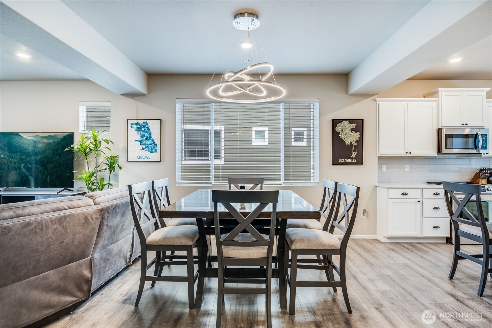 17539 110th Avenue East, Unit H Puyallup, WA 98374 - Photo 10 of 40 a view of a dining room with furniture and wooden floor
