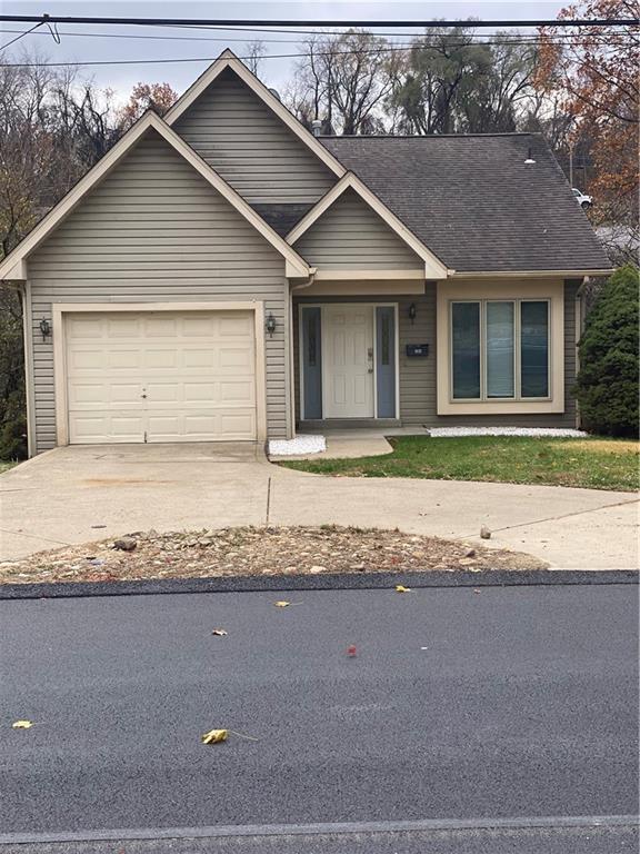 280 Old Lebanon Church Road Pittsburgh, PA 15236 - Photo 1 of 29 a front view of a house with a yard and garage