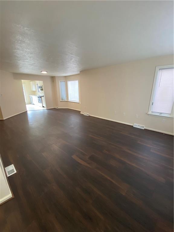 280 Old Lebanon Church Road Pittsburgh, PA 15236 - Photo 2 of 29 an empty room with wooden floor and windows