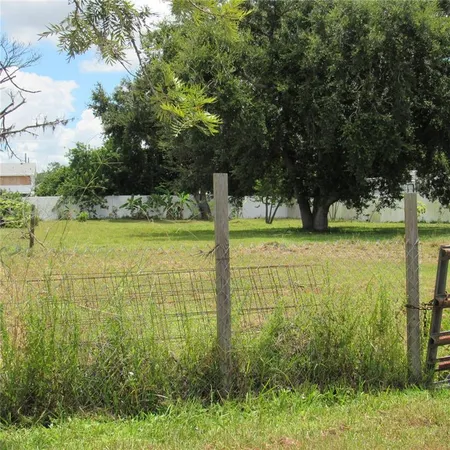 a view of an ocean with a building in the background