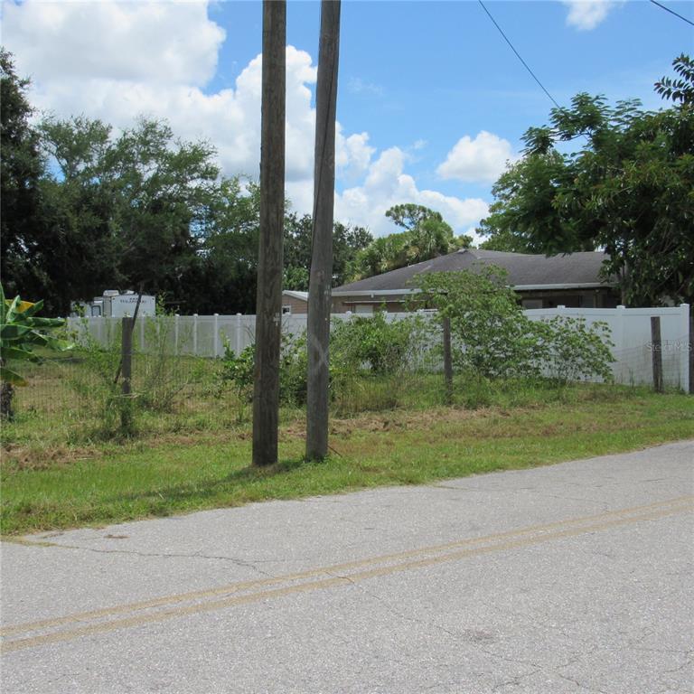 6725 Quonset Road Bradenton, FL 34203 - Photo 9 of 11 a green field with lots of tress in it