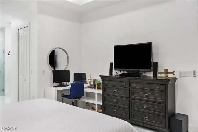 a bathroom with a shower and a sink