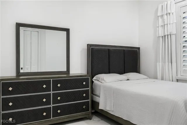 a room with a flat screen tv and a fireplace