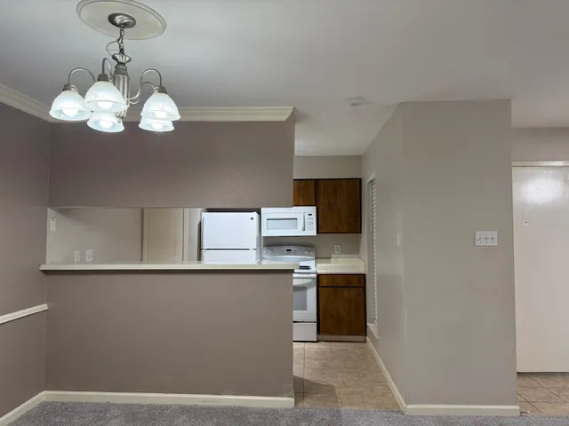 a view of a kitchen center island wooden floor and stove