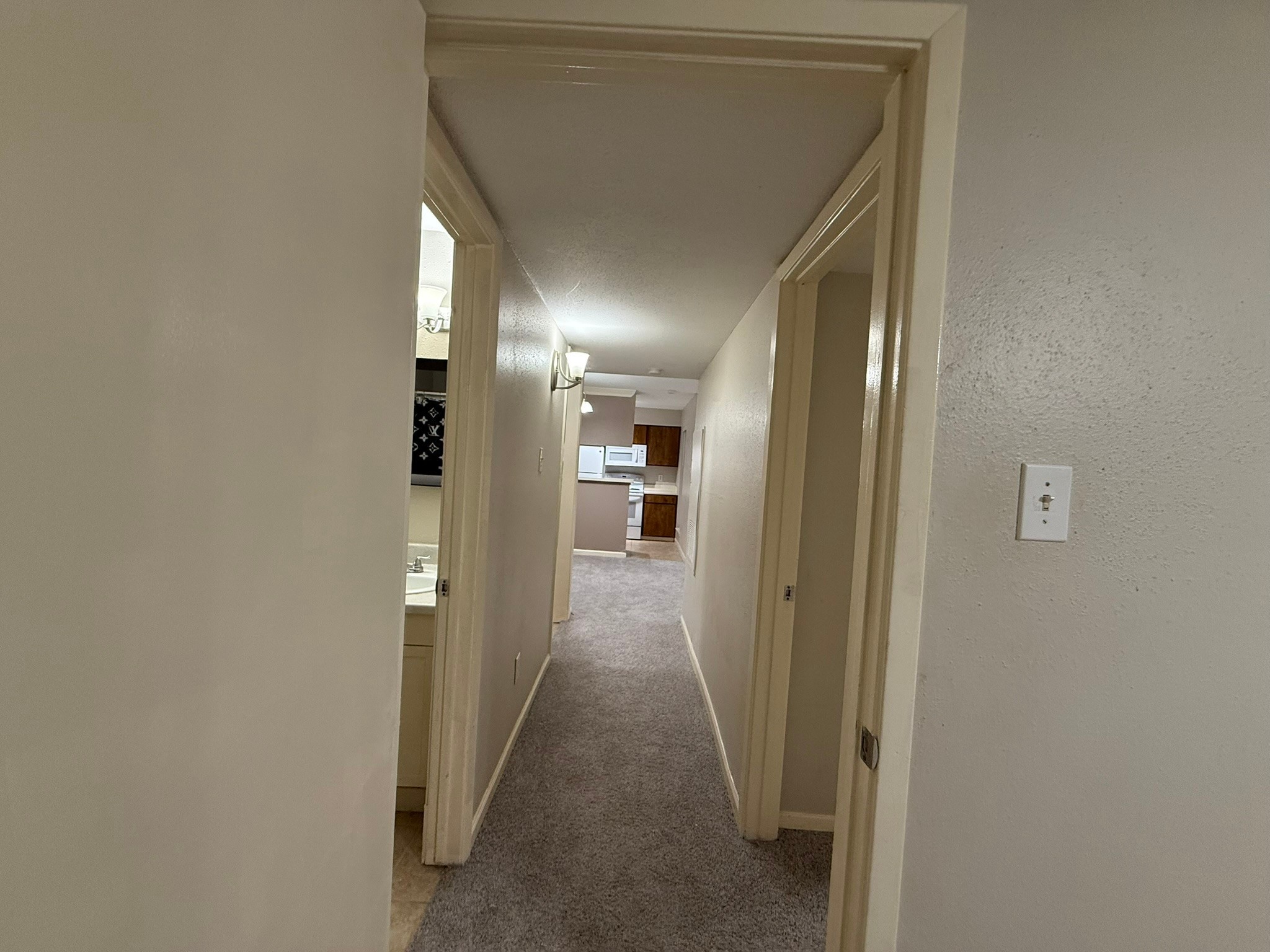 16303 Lyons School Road, Unit 315 Spring, TX 77379 - Photo 16 of 20 a view of a hallway with wooden shelves
