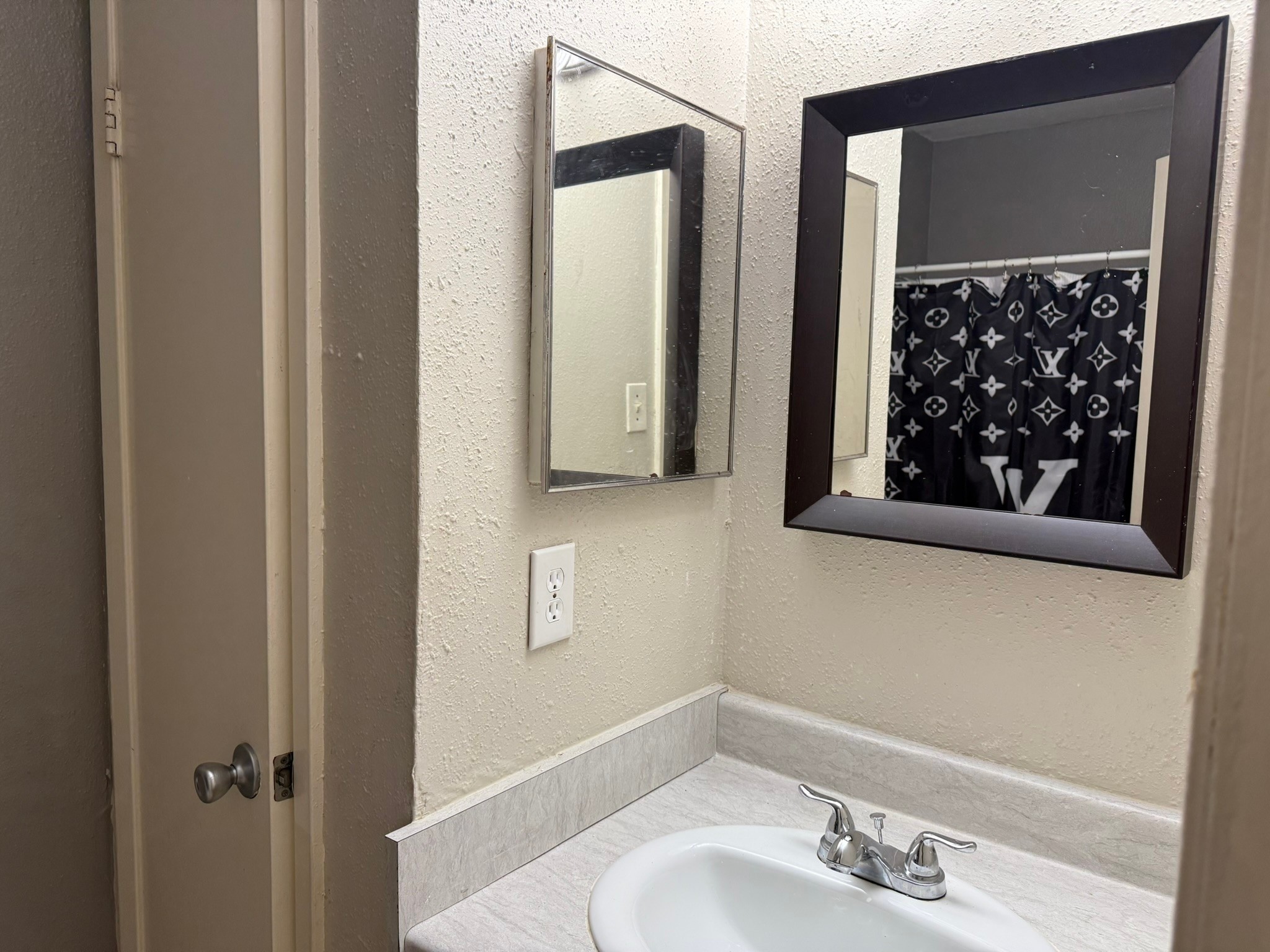 16303 Lyons School Road, Unit 315 Spring, TX 77379 - Photo 7 of 20 a bathroom with a sink and a mirror