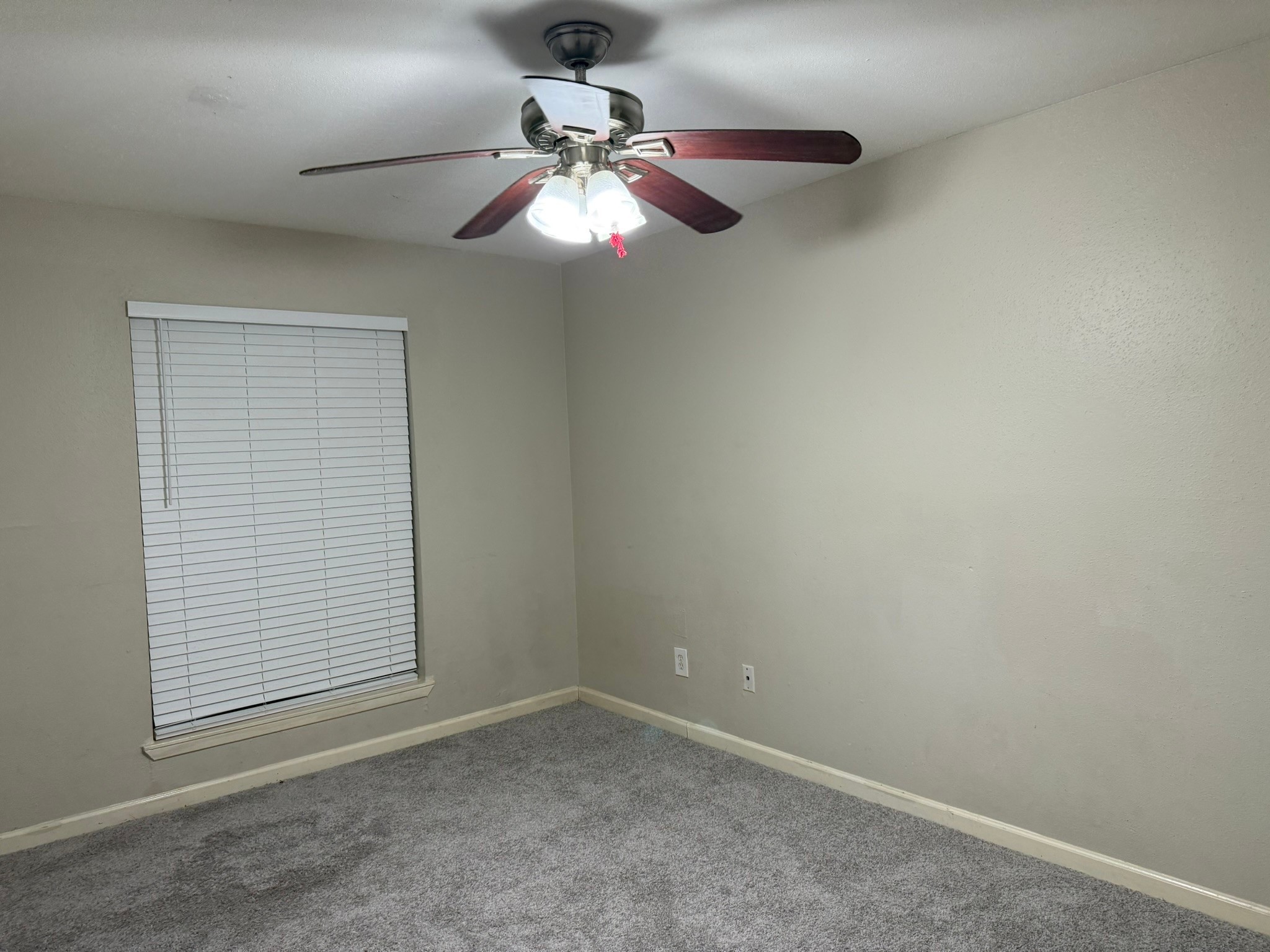 16303 Lyons School Road, Unit 315 Spring, TX 77379 - Photo 9 of 20 en empty room with window and chandelier fan
