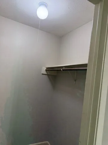 a close view of a closet in the bathroom