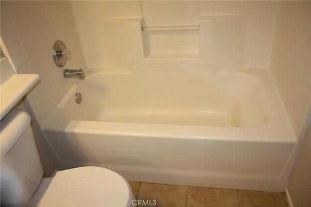 a bathroom with a bathtub and a sink
