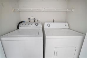 9769 Riverside Drive, Unit 712 Coral Springs, FL 33071 - Photo 16 of 18 a utility room with dryer and washer