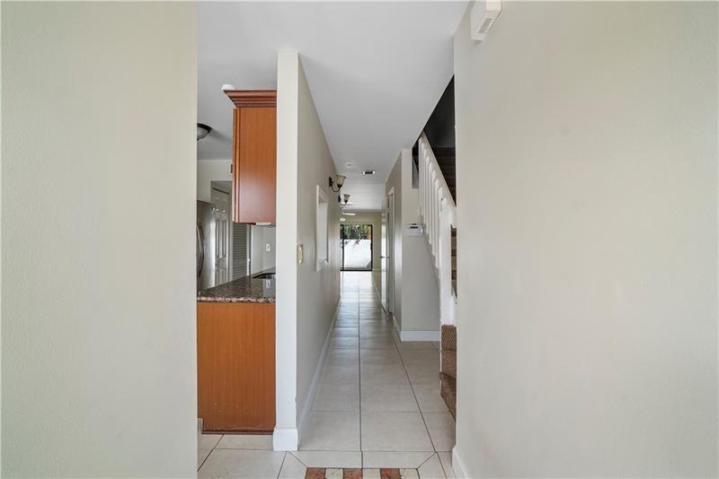 9769 Riverside Drive, Unit 712 Coral Springs, FL 33071 - Photo 4 of 18 a view of a hallway with seating area