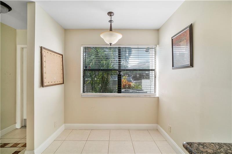 9769 Riverside Drive, Unit 712 Coral Springs, FL 33071 - Photo 7 of 18 a view of an empty room with a window