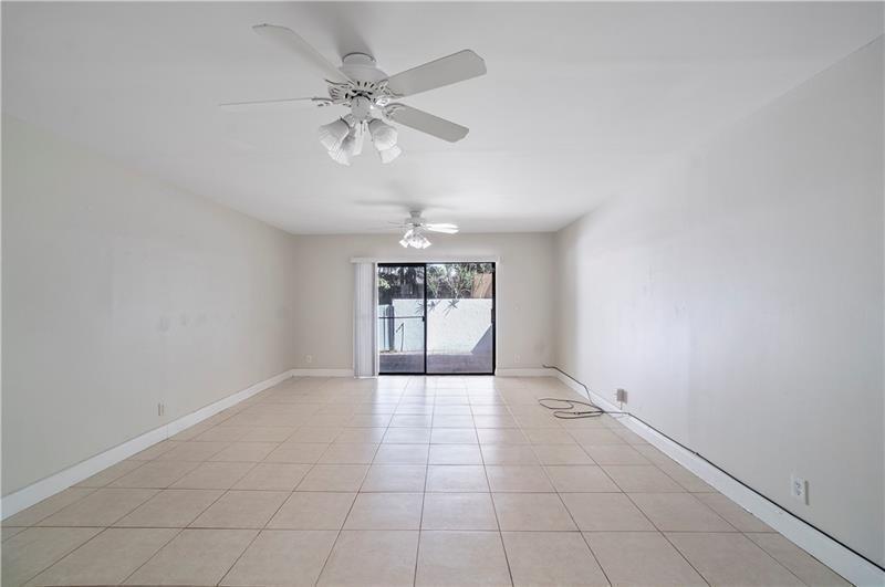 9769 Riverside Drive, Unit 712 Coral Springs, FL 33071 - Photo 8 of 18 a view of an empty room with a window