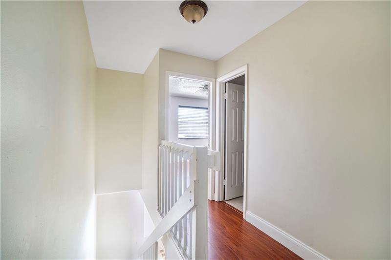 9769 Riverside Drive, Unit 712 Coral Springs, FL 33071 - Photo 9 of 18 a view of entryway with wooden floor