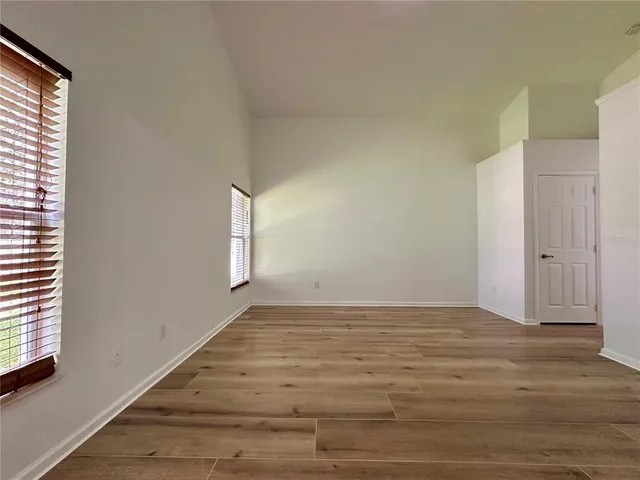 a view of an empty room and window