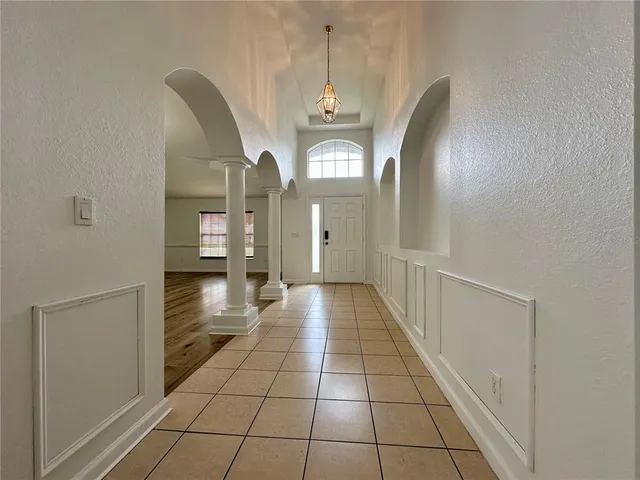 a view of a bathroom with a sink and a mirror