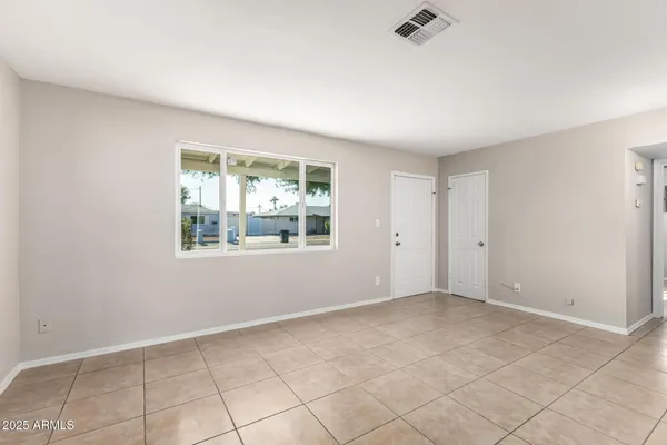 a view of an empty room with a window