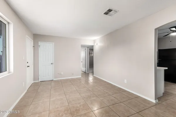 a view of an empty room with a window