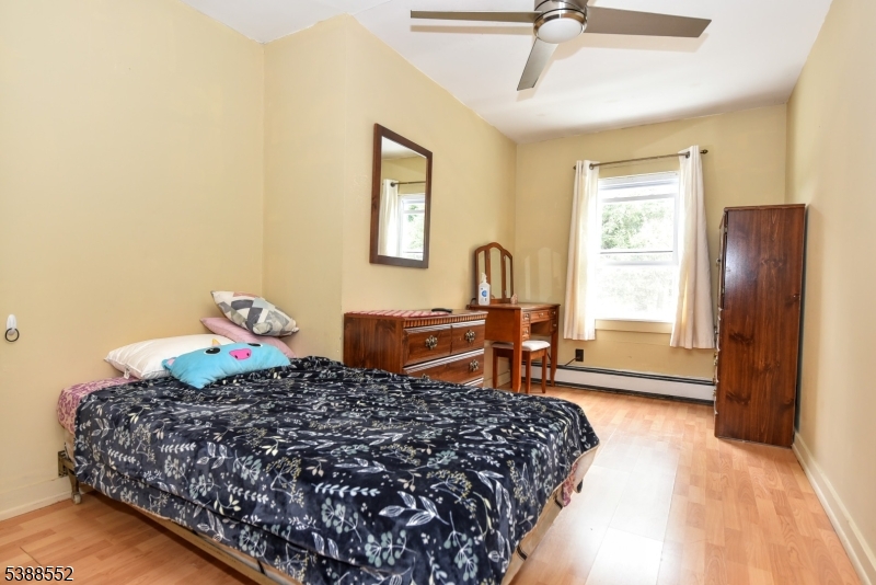435 Northern Parkway Ridgewood, NJ 07450 - Photo 12 of 22 a bedroom with a bed and wooden floor