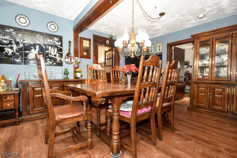 435 Northern Parkway Ridgewood, NJ 07450 - Photo 4 of 22 a view of a dining room with furniture a chandelier and wooden floor
