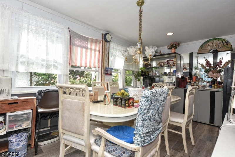 435 Northern Parkway Ridgewood, NJ 07450 - Photo 7 of 22 a dining room with furniture a chandelier and wooden floor