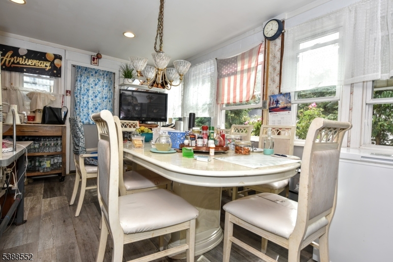 435 Northern Parkway Ridgewood, NJ 07450 - Photo 8 of 22 a dining room with furniture a chandelier and window