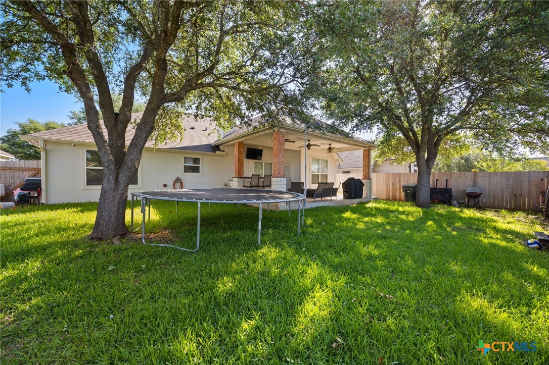 910 Neuberry Cliffe Temple, TX 76502 - Photo 25 of 32 a house view with a garden and trees