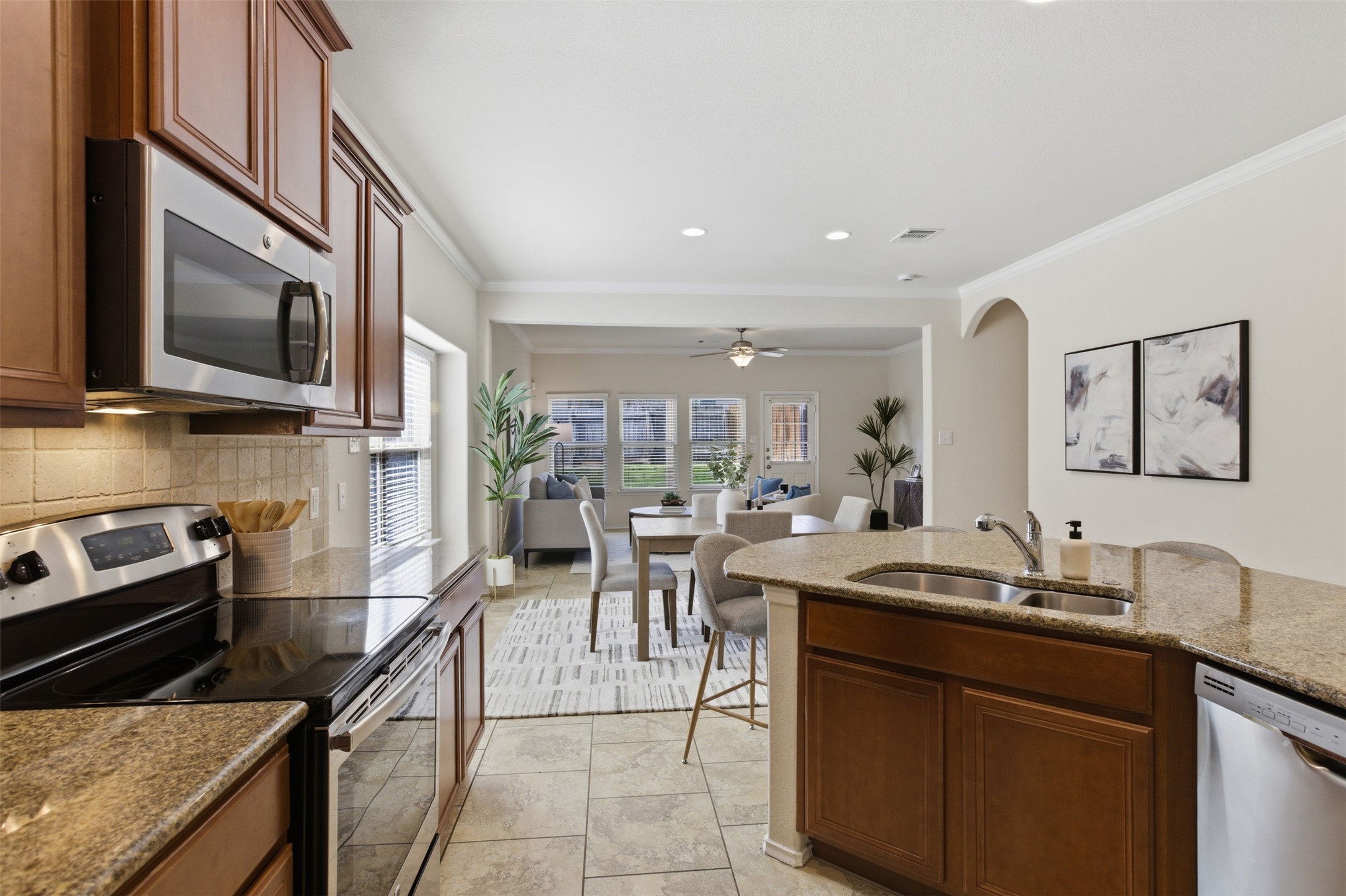 124 Golden Eagle Leander, TX 78641 - Photo 12 of 32 Stainless appliances and a corner pantry align well with this kitchen.