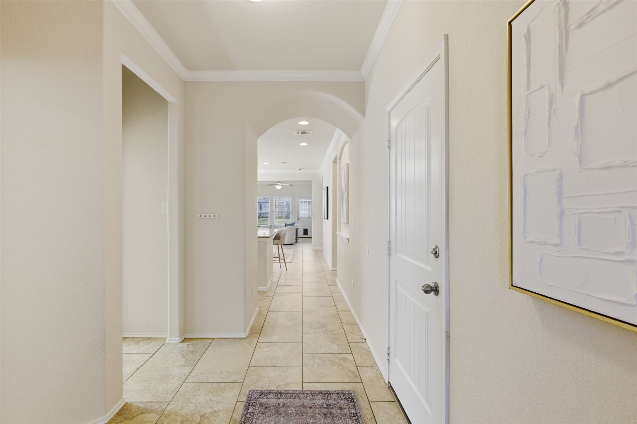 124 Golden Eagle Leander, TX 78641 - Photo 7 of 32 The wider entry is usable. To the left is the home office and utility area, to the right is the garage.