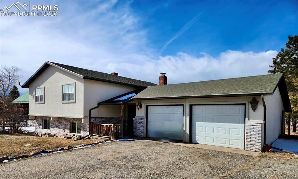302 5th Street Westcliffe, CO 81252 - Photo 1 of 7 a front view of a house with a garage