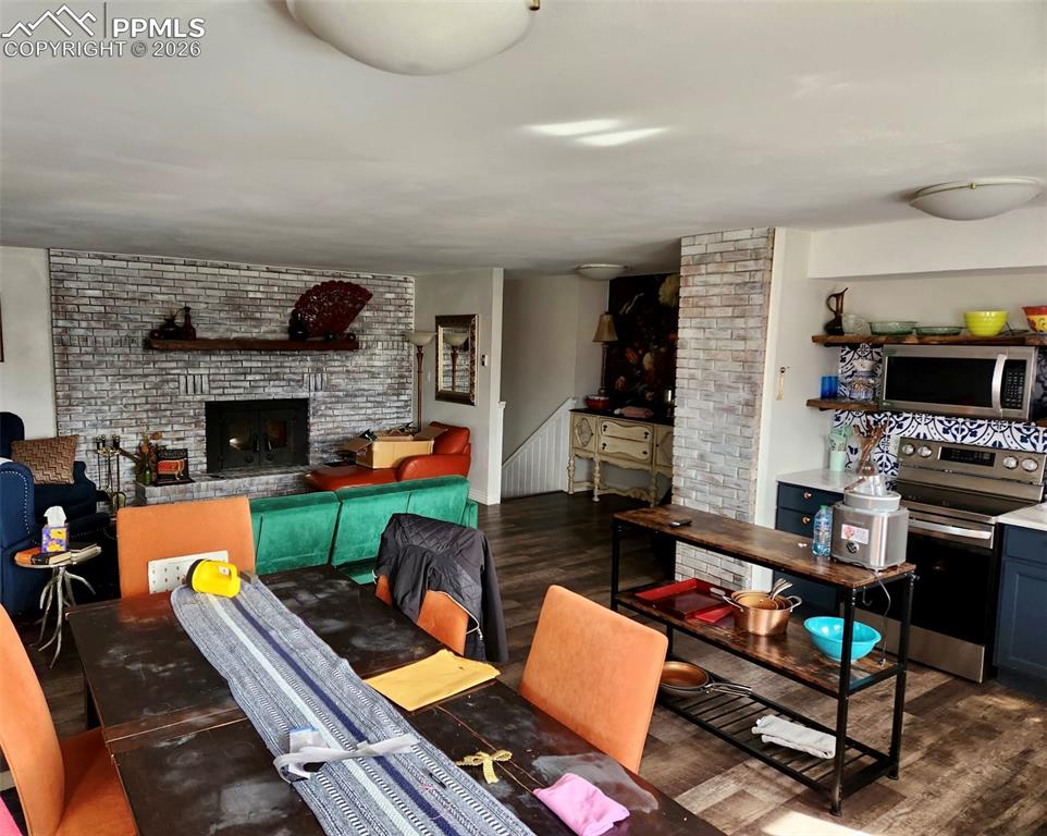 302 5th Street Westcliffe, CO 81252 - Photo 4 of 7 a living room with furniture fireplace and a fireplace
