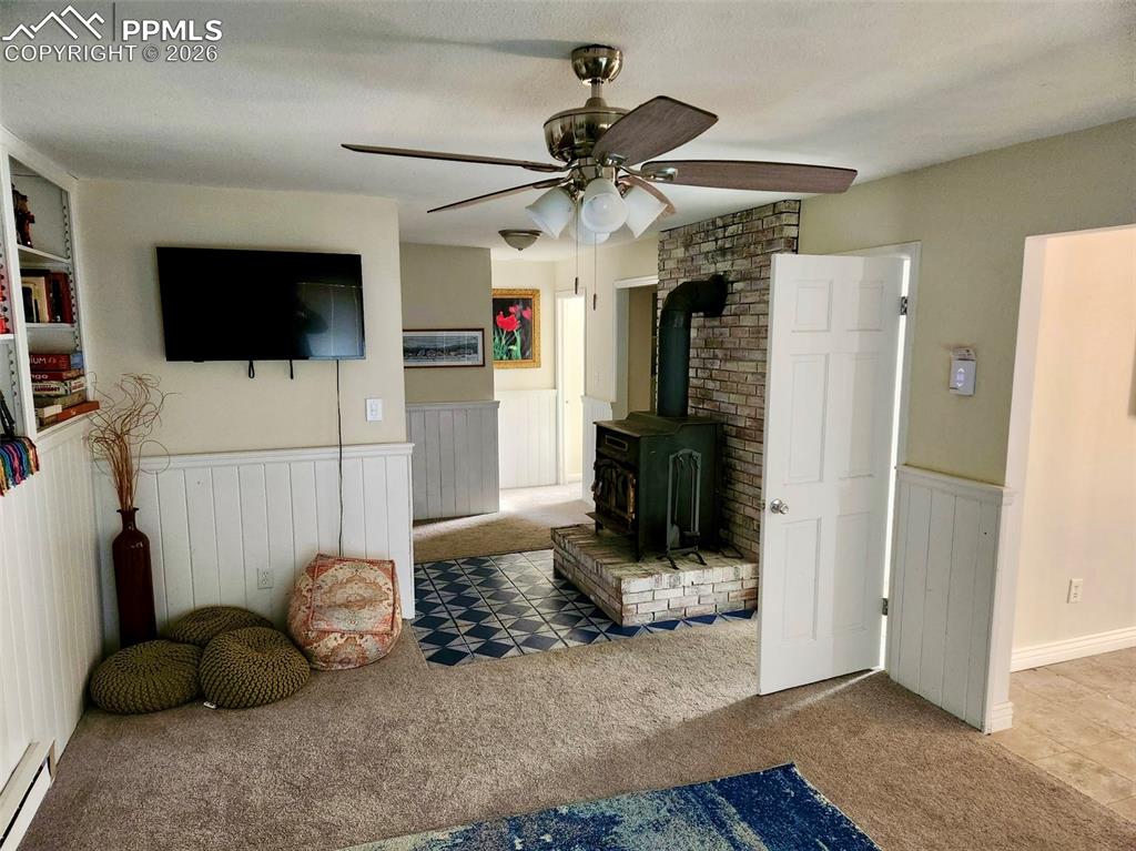 302 5th Street Westcliffe, CO 81252 - Photo 6 of 7 a living room with furniture and a flat screen tv