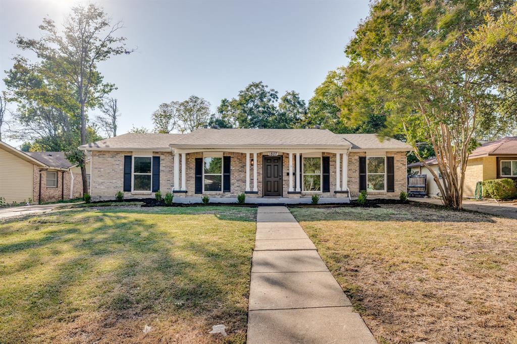 1807 North Waterview Drive Richardson, TX 75080 - Photo 1 of 26 front view of a house with a patio