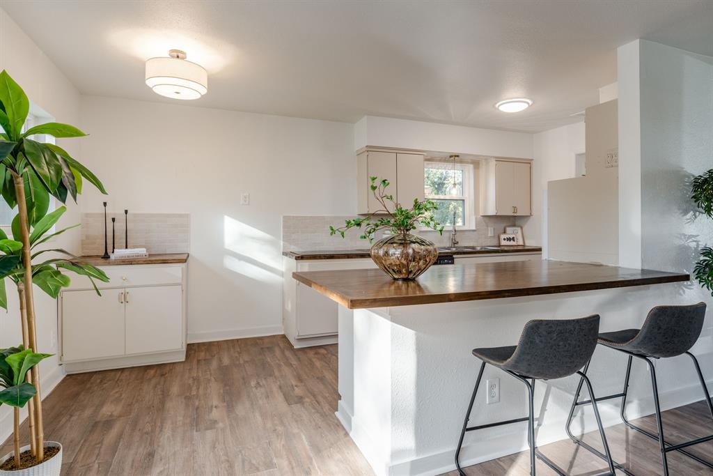 1807 North Waterview Drive Richardson, TX 75080 - Photo 12 of 26 a kitchen with a sink and cabinets