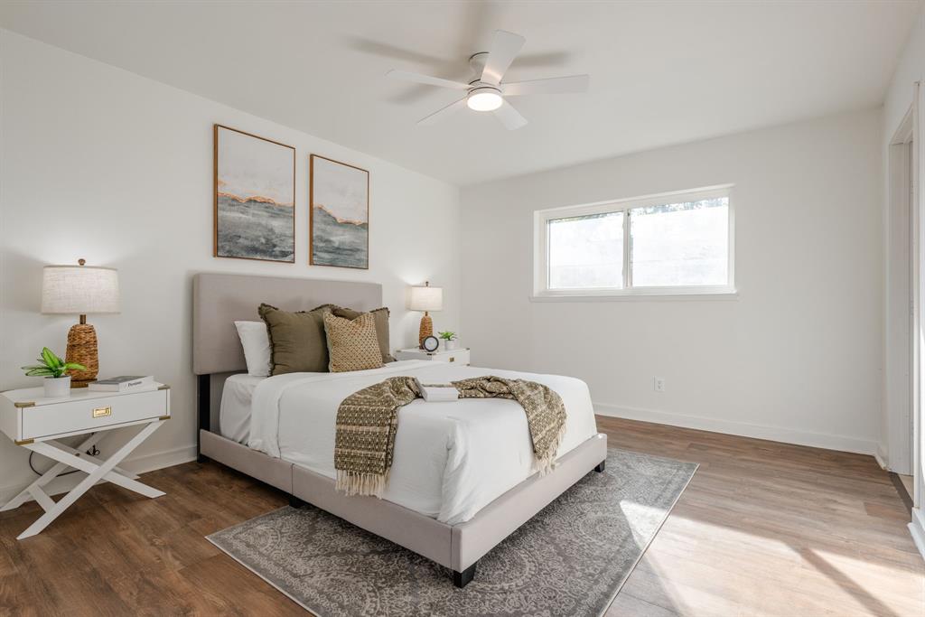 1807 North Waterview Drive Richardson, TX 75080 - Photo 14 of 26 a bedroom with bed and a window