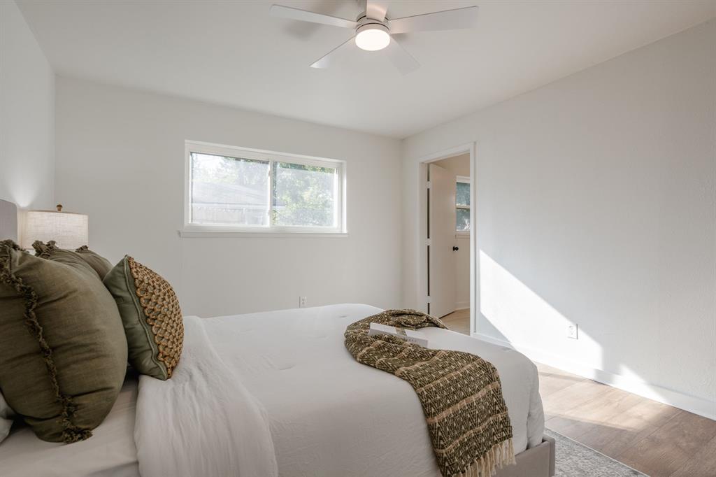 1807 North Waterview Drive Richardson, TX 75080 - Photo 15 of 26 a bedroom with a bed and a window