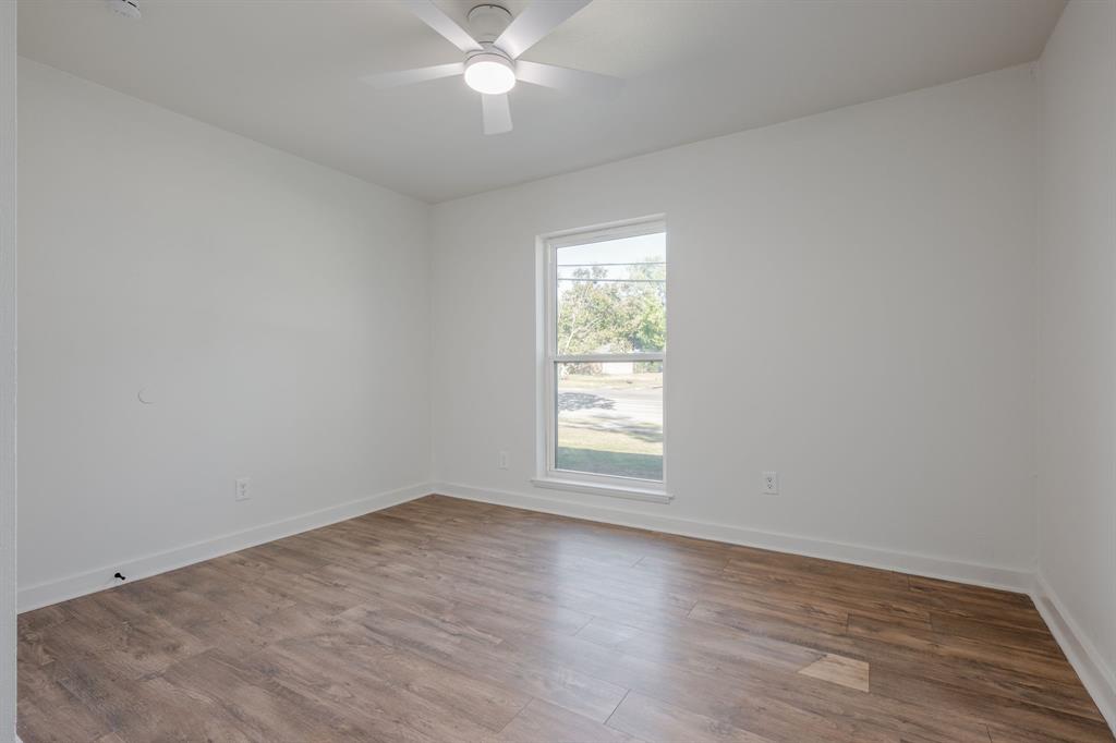 1807 North Waterview Drive Richardson, TX 75080 - Photo 18 of 26 an empty room with wooden floor and windows