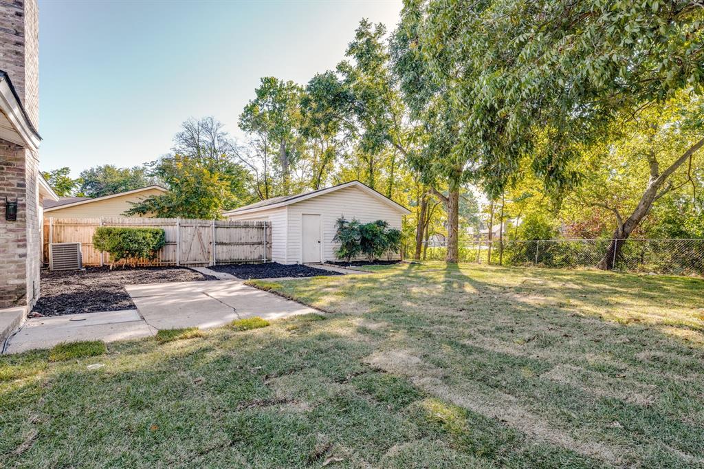 1807 North Waterview Drive Richardson, TX 75080 - Photo 21 of 26 a view of a yard with a house and trees